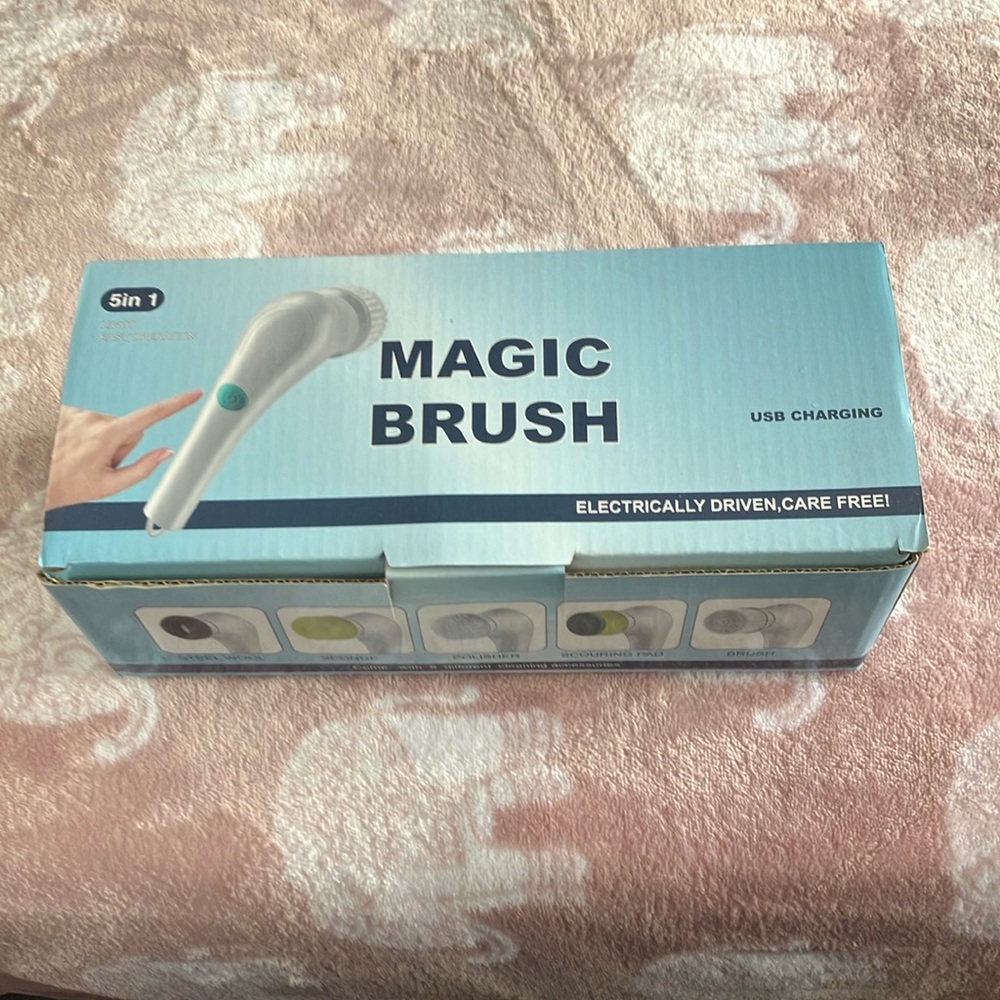 Magic Brush NIB, USB charging w/5 different cleaning accessories.